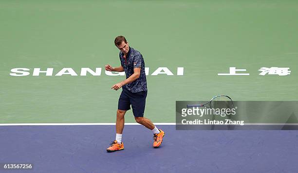 Albert Ramos-Vinolas of Spain smashes his racquet in frustration during against Fabio Fognini of Italy in the Men's singles match on day one of...
