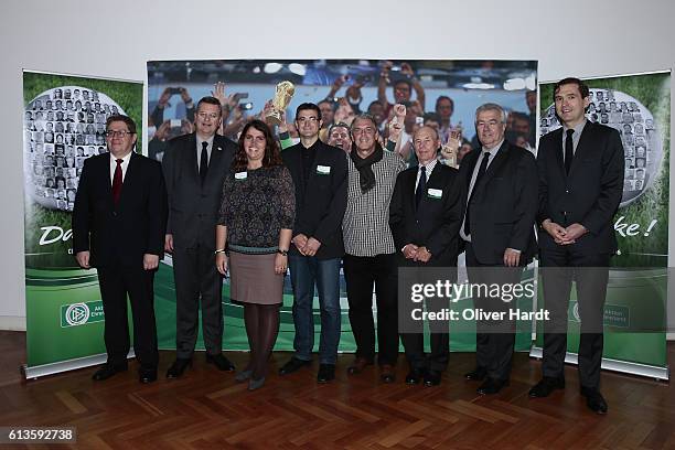 Reinhard Grindel poses with members of the Football Association of Rheinland during Club 100 & Fair Ist Mehr - Awarding Ceremony at Curio Haus on...