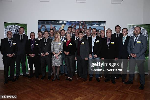 Reinhard Grindel poses with members of the Football Association of Bayern during Club 100 & Fair Ist Mehr - Awarding Ceremony at Curio Haus on...