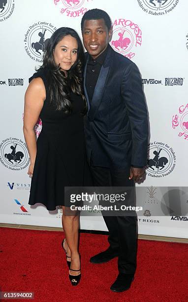 Actress Nicole Pantenburg and record producer Kenny "Babyface" Edmonds arrive for the 2016 Carousel Of Hope Ball held at The Beverly Hilton Hotel on...