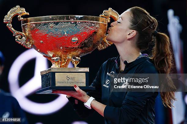Agnieszka Radwanska of Poland holds the winners trophy after winning the Women's Singles final against Johanna Konta of Great Britain on day nine of...
