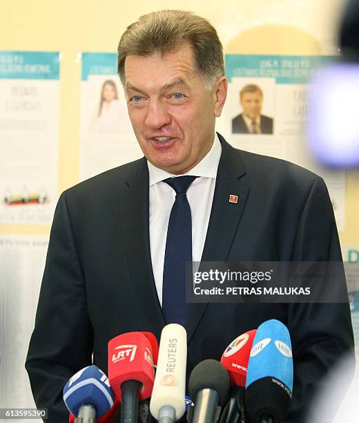 Lithuanian Prime Minister and leader of the Lithuanian Social Democratic Party Algirdas Butkevicius talks to the media after he casted his ballot at...