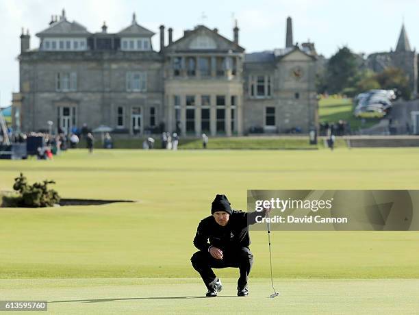 Lasse Jensen of Denmark lines up a putt on the first green during the final round of the Alfred Dunhill Links Championship at The Old Course on...