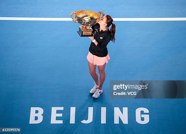 Agnieszka Radwanska of Poland holds the winners trophy after winning the Women's Singles final against Johanna Konta of Great Britain on day nine of...