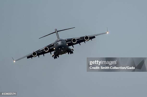 Air Force C-17 Globemaster III puts its wheels down as it comes in to land on the flightline at Fort Campbell, Kentucky, October 6, 2016. Joint Base...