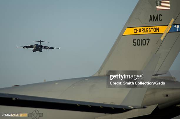 Air Force C-17 Globemaster III begins to land on the flightline at Fort Campbell, Kentucky, October 6, 2016. Joint Base Charleston C-17 Globemaster...