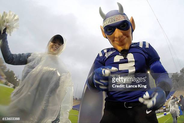 Cheerleader and the mascot of the Duke Blue Devils pose for a photo prior to their game against the Army Black Knights at Wallace Wade Stadium on...