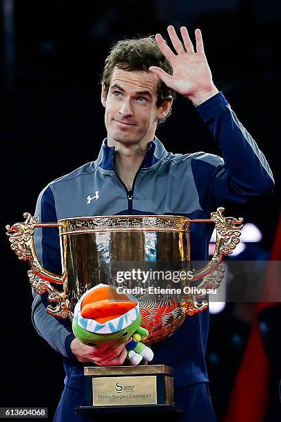 Andy Murray of Great Britain holds the winners trophy after winning the Men's Singles final against Grigor Dimitrov of Bulgaria on day nine of the...