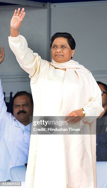 Bahujan Samaj Party Supremo Mayawati waves during the rally on the tenth death anniversary of BSP Founder Kanshi Ram at Kanshi Ram Smarak Maidan, on...