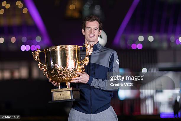 Andy Murray of Great Britain holds the winners trophy after winning the Men's Singles final against Grigor Dimitrov of Bulgaria on day nine of the...