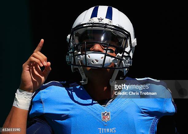 Marcus Mariota of the Tennessee Titans walks on to the field prior to a game against the Miami Dolphins at Hard Rock Stadium on October 9, 2016 in...