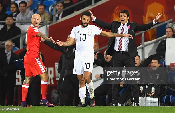 Chris Coleman, Manager of Wales reacts with David Cotterill of Wales and Tornike Okriashvili of Georgia during the FIFA 2018 World Cup Qualifier...