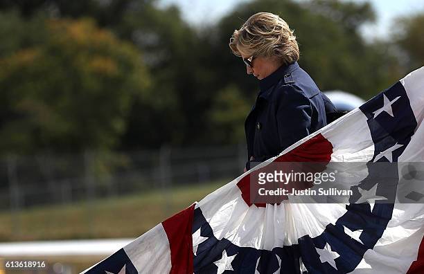 Democratic presidential nominee former Secretary of State Hillary Clinton arrives at Lambert-St. Louis International Airport on October 9, 2016 in St...
