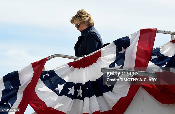 Democrat presidential nominee Hillary Clinton arrives October 9, 2016 at Lambert-St. Louis International Airport in St. Louis, Missouri where she...