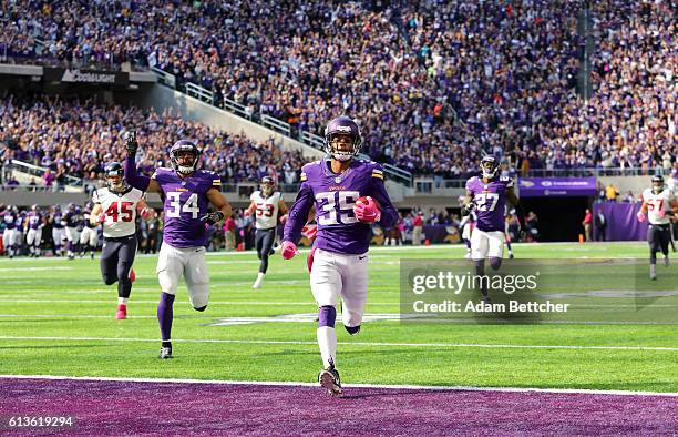 Marcus Sherels of the Minnesota Vikings returns a punt 79 yards for a touchdown in the second quarter of the game against the Houston Texans on...