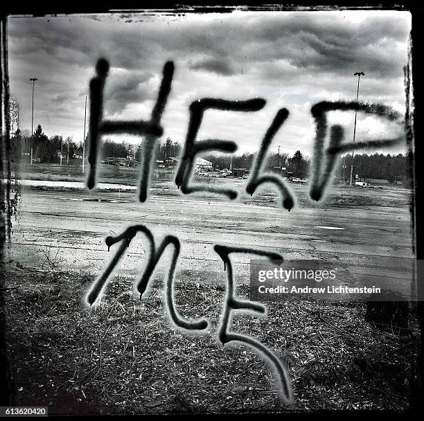 Grafitti painted on the window of the abandoned Apollo shopping mall seems to express the sentiment of many citizens of the struggling town on March...