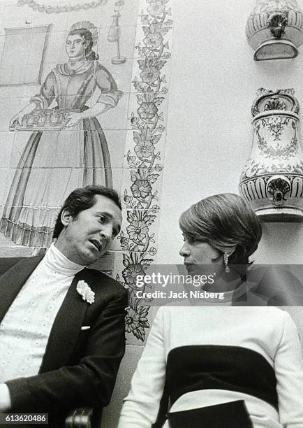 Don Luis Miguel Dominguin with Condesa de Villapadierna standing at the debut party of Carmen Martinez Bordiu near Madrid, Spain.