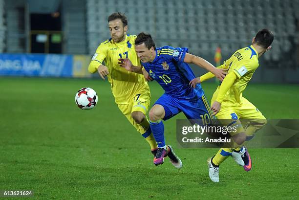 Yevhen Konoplyanka of Ukraine in action against Alban Meha and Fanol Perdedaj of Kosovo during the UEFA 2018 World Cup Qualifying match between...