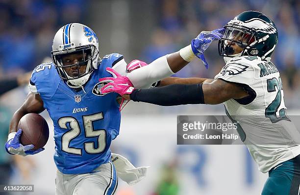 Theo Riddick of the Detroit Lions gives a stiff arm to Rodney McLeod of the Philadelphia Eagles during first half action at Ford Field on October 9,...