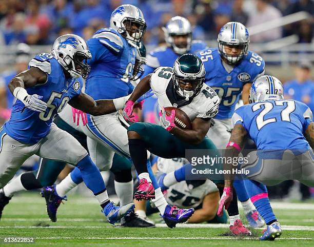 Darren Sproles of the Philadelphia Eagles runs for yardage against the Detroit Lions defensive during first half action at Ford Field on October 9,...