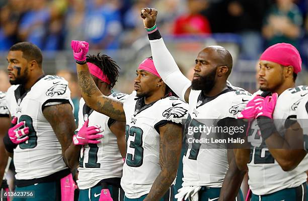 Ron Brooks of the Philadelphia Eagles and Malcolm Jenkins raise their fists during the National Anthem prior to the start of the game against the...