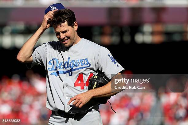 Rich Hill of the Los Angeles Dodgers walks off of the field in the fifth inning against the Washington Nationals during game two of the National...