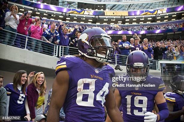 Cordarrelle Patterson of the Minnesota Vikings celebrates a 9 yard catch to score a touchdown during the fourth quarter of the game against the...