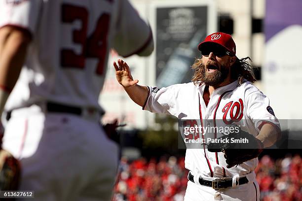 Jayson Werth of the Washington Nationals celebrates after making a catch for the third out of the fifth inning with bases loaded against the Los...