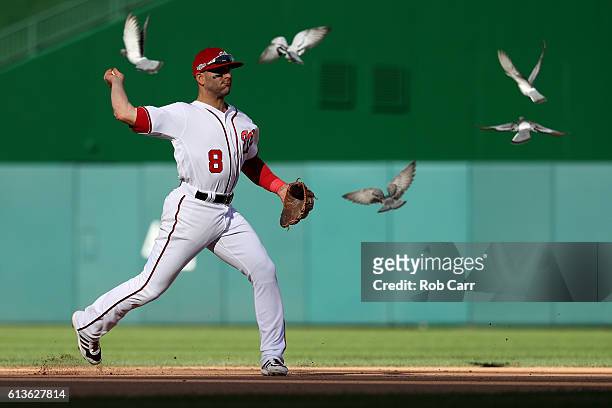 Danny Espinosa of the Washington Nationals makes a throw to first base for the second out of the seventh inning against the Los Angeles Dodgers while...