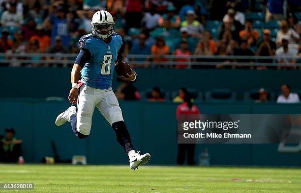 Marcus Mariota of the Tennessee Titans rushes during a game against the Miami Dolphins on October 9, 2016 in Miami Gardens, Florida.