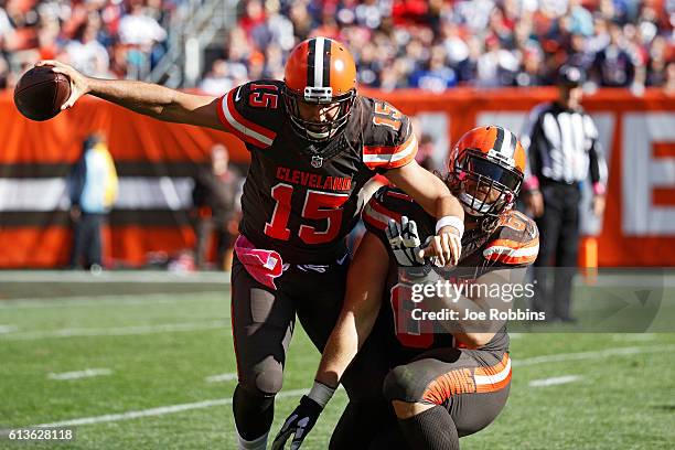 Charlie Whitehurst of the Cleveland Browns runs into Austin Pasztor while trying to pass against the New England Patriots in the fourth quarter of...