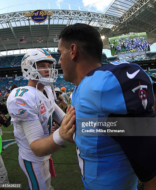 Ryan Tannehill of the Miami Dolphins and Marcus Mariota of the Tennessee Titans shake hands during a game on October 9, 2016 in Miami Gardens,...