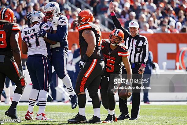 Malcom Brown and Alan Branch of the New England Patriots celebrate after sacking Charlie Whitehurst of the Cleveland Browns in the third quarter of...