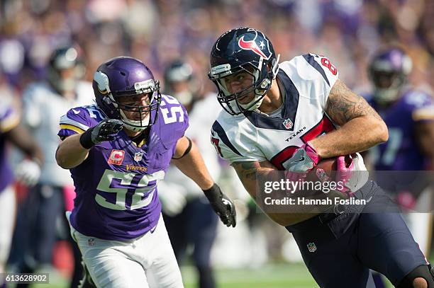 Fiedorowicz of the Houston Texans runs past Chad Greenway of the Minnesota Vikings after a catch during the fourth quarter of the game on October 9,...