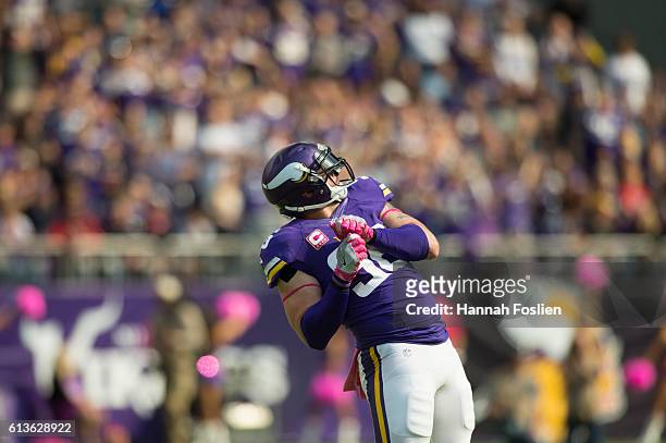 Brian Robison of the Minnesota Vikings celebrates after sacking quarterback Brock Osweiler of the Houston Texans during the third quarter of the game...