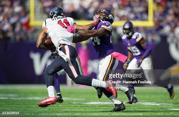 Jaelen Strong of the Houston Texans pushes off the face mask of Captain Munnerlyn of the Minnesota Vikings during the third quarter of the game on...