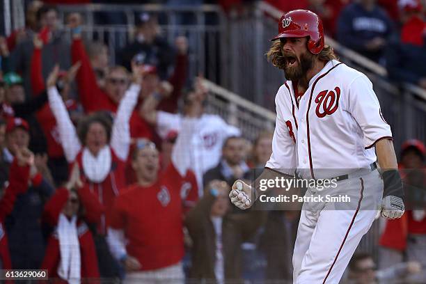 Jayson Werth of the Washington Nationals celebrates after scoring off of an RBI single hit by Daniel Murphy in the seventh inning against the Los...