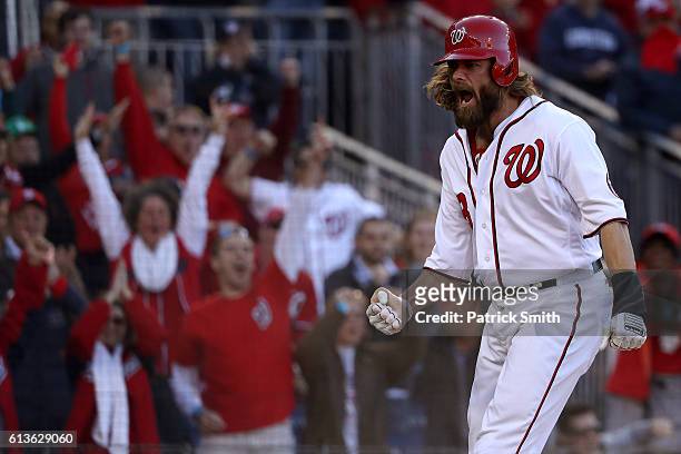 Jayson Werth of the Washington Nationals celebrates after scoring off of an RBI single hit by Daniel Murphy in the seventh inning against the Los...