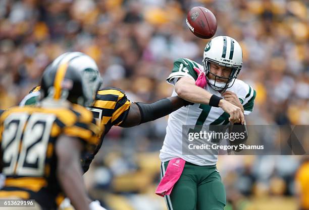 Ryan Fitzpatrick of the New York Jets gets a pass knocked out of his hand during the first quarter by Arthur Moats of the Pittsburgh Steelers at...