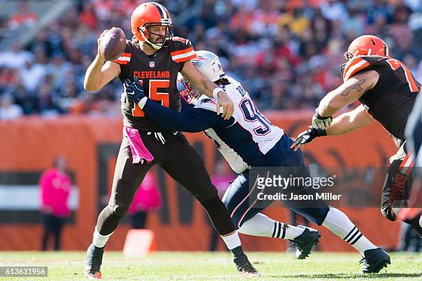 Quarterback Charlie Whitehurst of the Cleveland Browns is sacked by defensive tackle Malcom Brown of the New England Patriots at FirstEnergy Stadium...