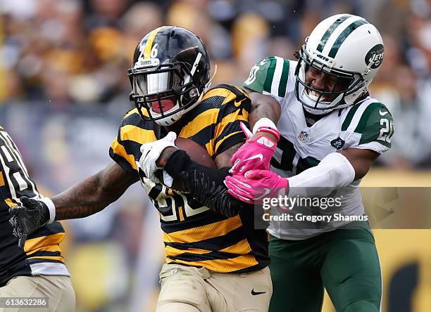 Le'Veon Bell of the Pittsburgh Steelers tries to get around the tackle of Marcus Williams of the New York Jets during a fourth quarter run at Heinz...