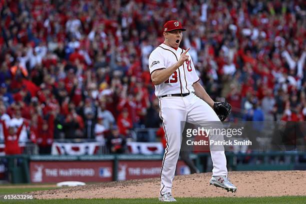 Mark Melancon of the Washington Nationals celebrates after the Washington Nationals defeated the Los Angeles Dodgers 5-2 in game two of the National...