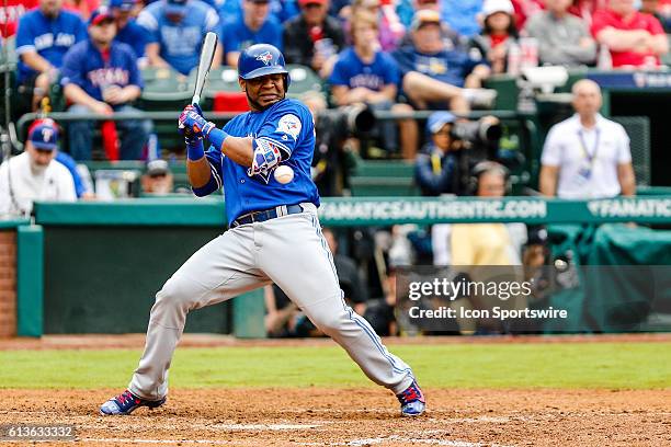 Toronto Blue Jays designated hitter Edwin Encarnacion flinches at an inside pitch during the game between the Texas Rangers and Toronto Blue Jays at...