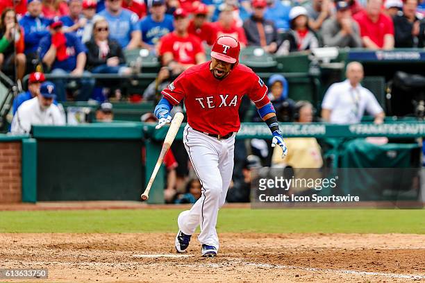 Texas Rangers catcher Robinson Chirinos shows some emotion after taking a walk during the game between the Texas Rangers and Toronto Blue Jays at...