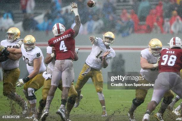 Notre Dame Fighting Irish quarterback DeShone Kizer throws a pass against the NC State Wolfpack during the second half at Carter-Finley Stadium in...