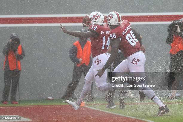 State Wolfpack safety Dexter Wright runs in a touchdown after a blocked punt during the second half against the Notre Dame Fighting Irish at...