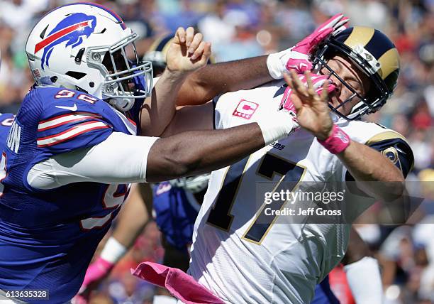 Adolphus Washington of the Buffalo Bills gets called for a roughing the passer penalty on quarterback Case Keenum of the Los Angeles Rams during the...