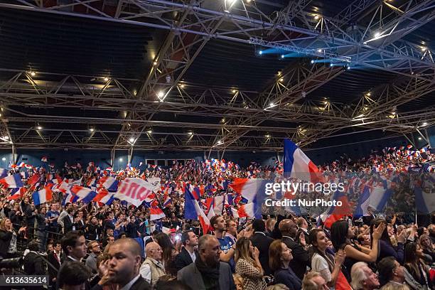 Supporters of Nicolas Sarkozy, former French president who is running again in the next election, as seen during a campaign rally at Le Zenith in...