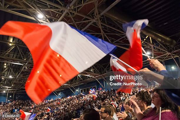 Supporters of Nicolas Sarkozy, former French president who is running again in the next election, as seen during a campaign rally at Le Zenith in...