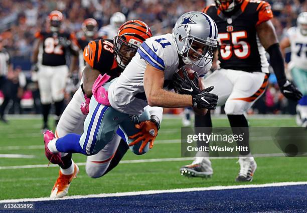 Cole Beasley of the Dallas Cowboys dives into the end zone to score a touchdown after catching a pass from quarterback Dak Prescott during the second...